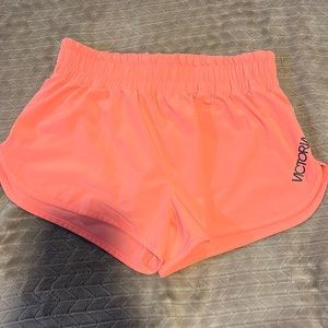 Bright pink Victoria Sport running shorts